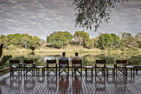 The view of the river flowing in front of Simbavati River Lodge. Guests can view hippos and other wildlife from the lodge.