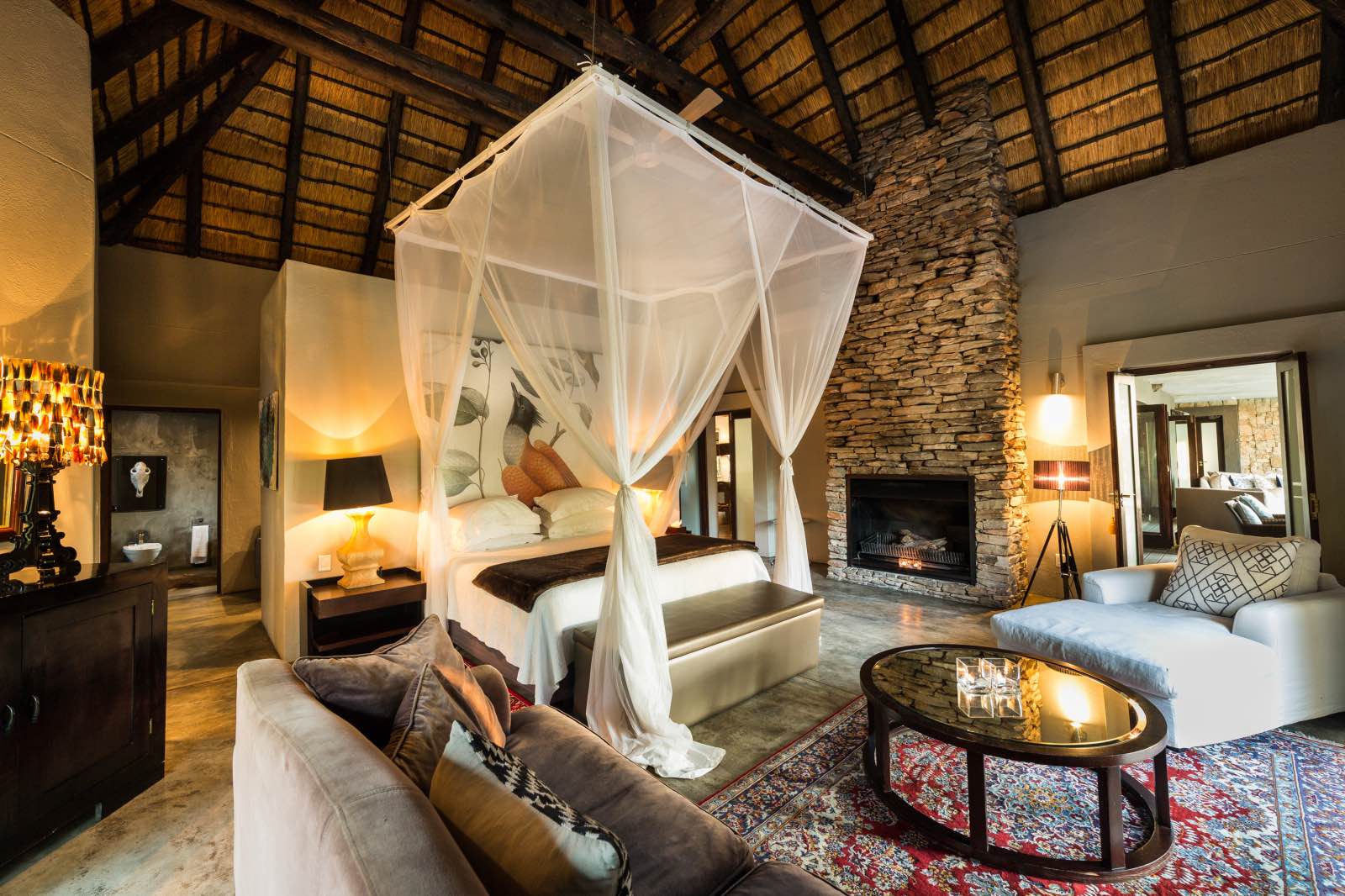 Chitwa House bedroom suite with high thatched ceiling and exquisite detail