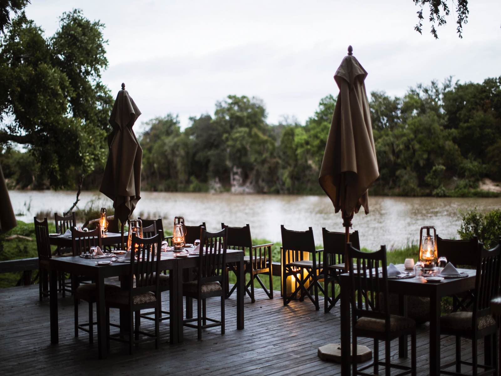 Simbavati River Lodge dining deck overlooking the Nhlaralumi River in flood during summer