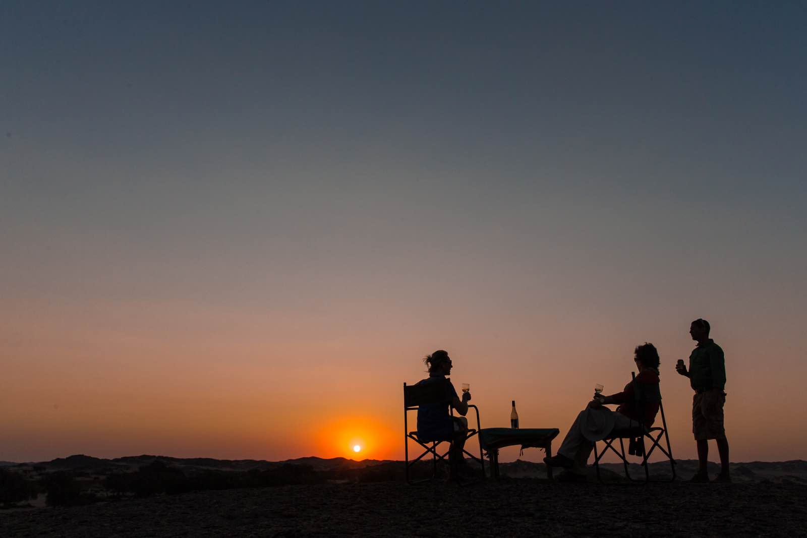 Hoanib Skeleton Coast Camp sundowners silhouette