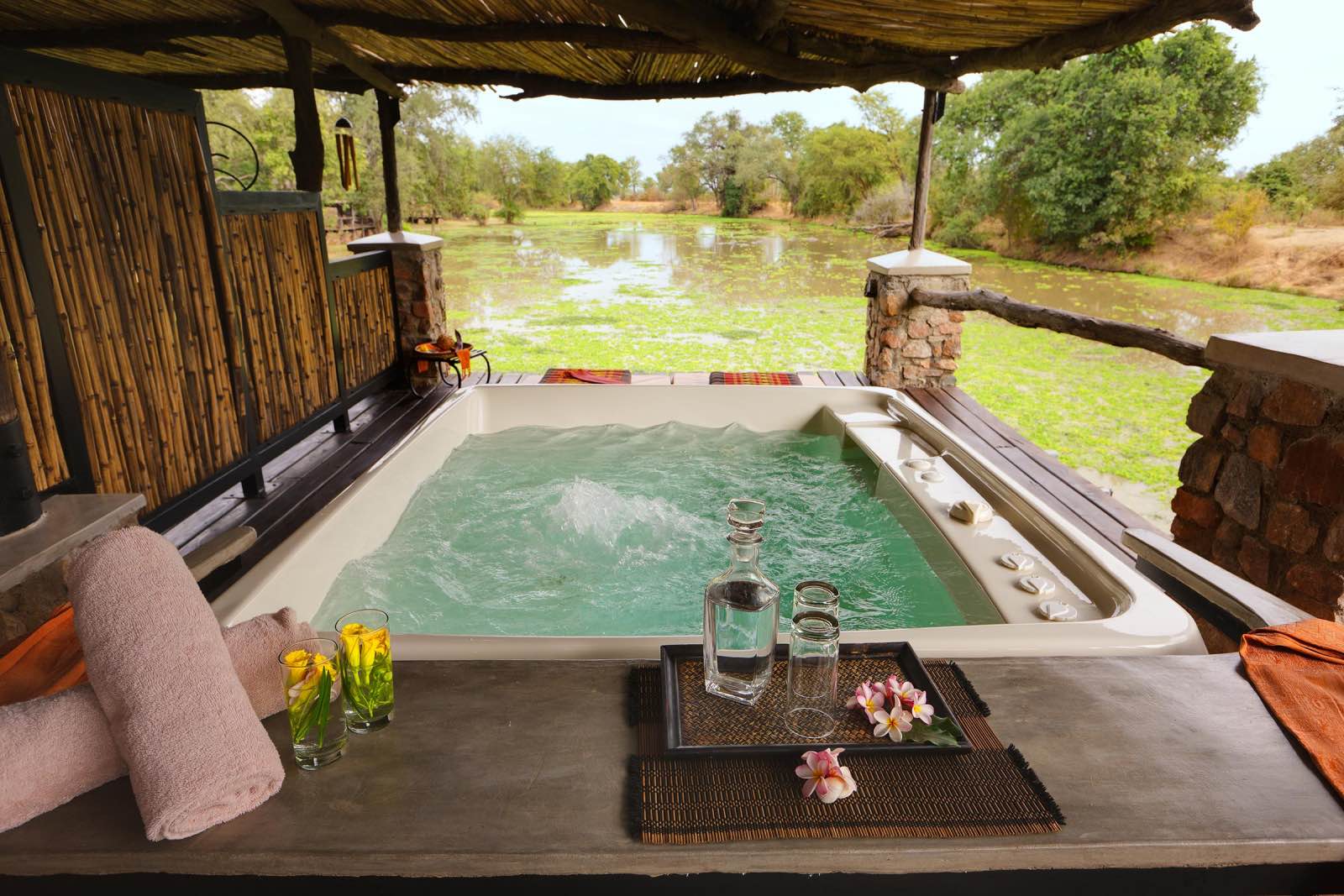 A jacuzzi with a view of the hippo-filled swamp