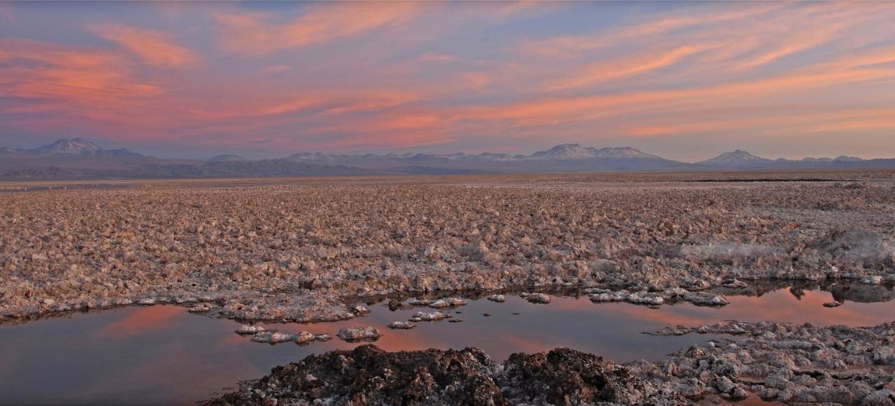 Lunar landscape sunset and jagged terrain in Atacama Desert