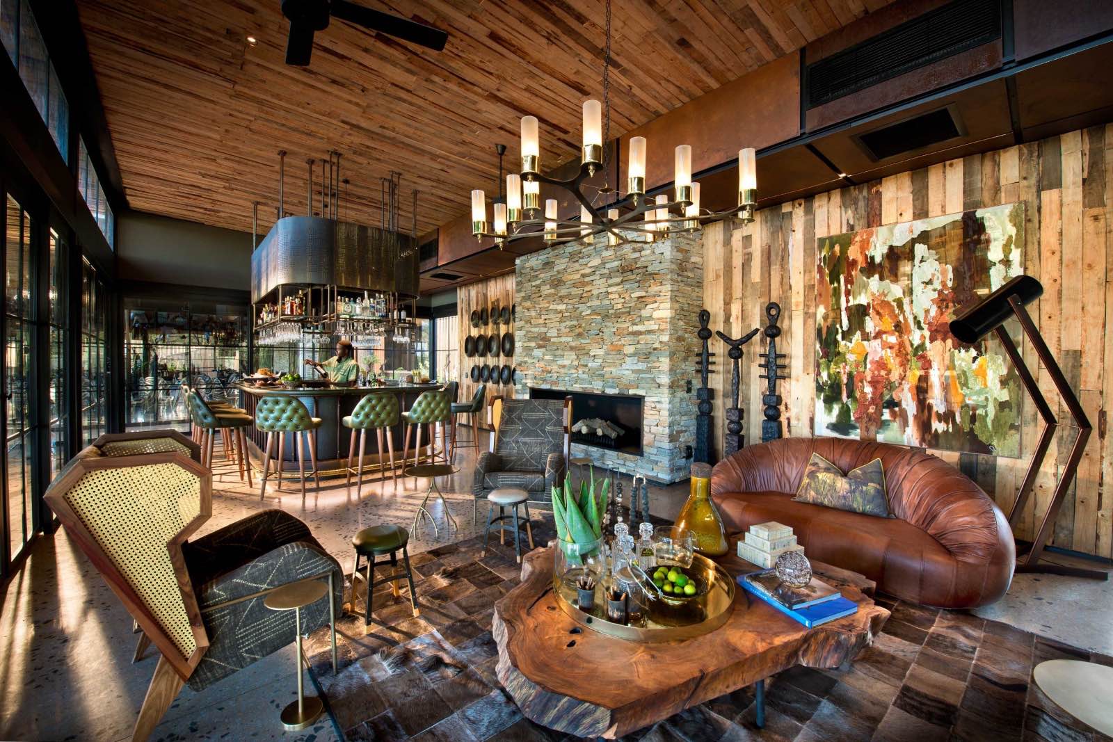 Bar and lounge with artistic, organic decor at Tengile River Lodge