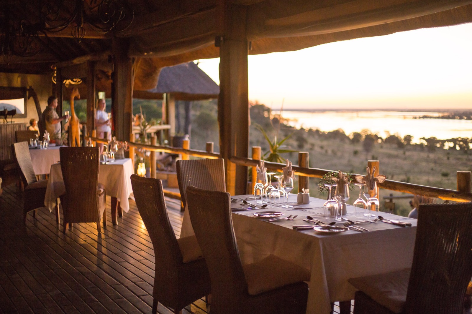 Dinners tables set and looking out onto a view of the Chobe River in Botswana